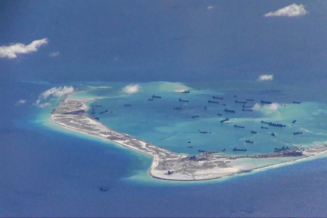 Chinese dredging vessels are purportedly seen in the waters around Mischief Reef in the disputed Spratly Islands in the South China Sea, in this 2015 handout photo from the US Navy. Photo: Reuters