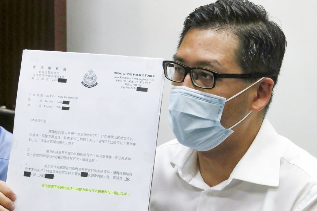 Democratic Party lawmaker Lam Cheuk-ting displays the letter he received from police thanking him for ‘fulfilling’ his responsibility in reporting the crime. Photo: Edmond So