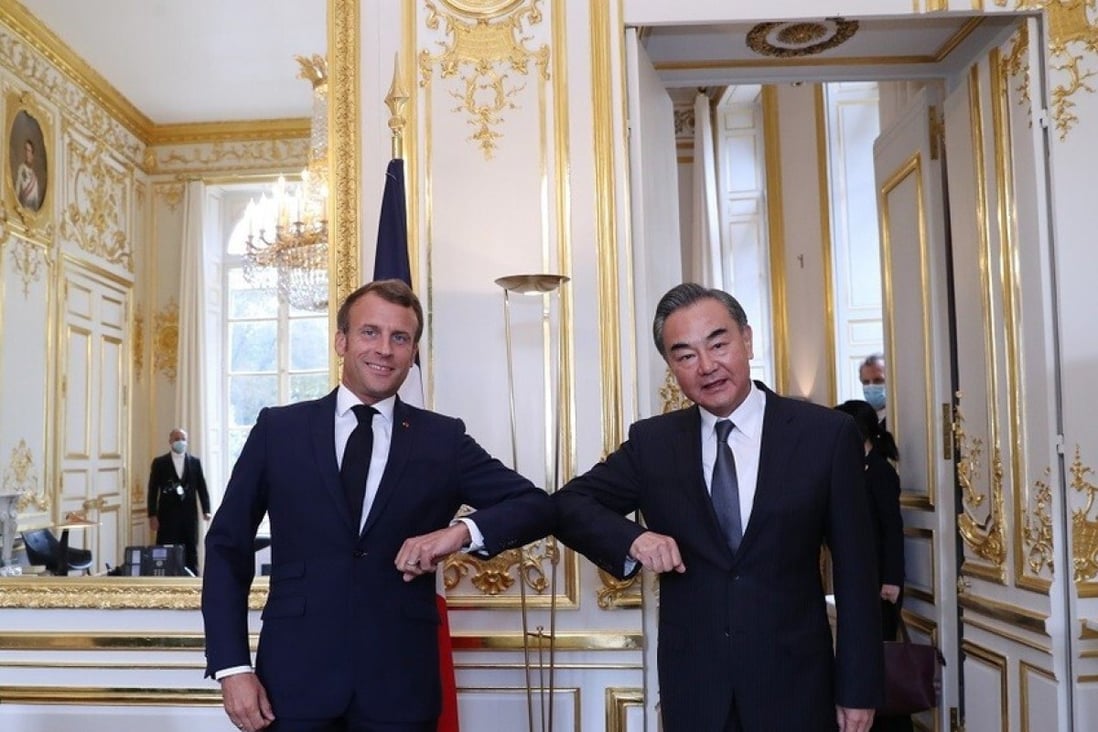 Emmanuel Macron pictured with Wang Yi in Paris. Photo: Handout