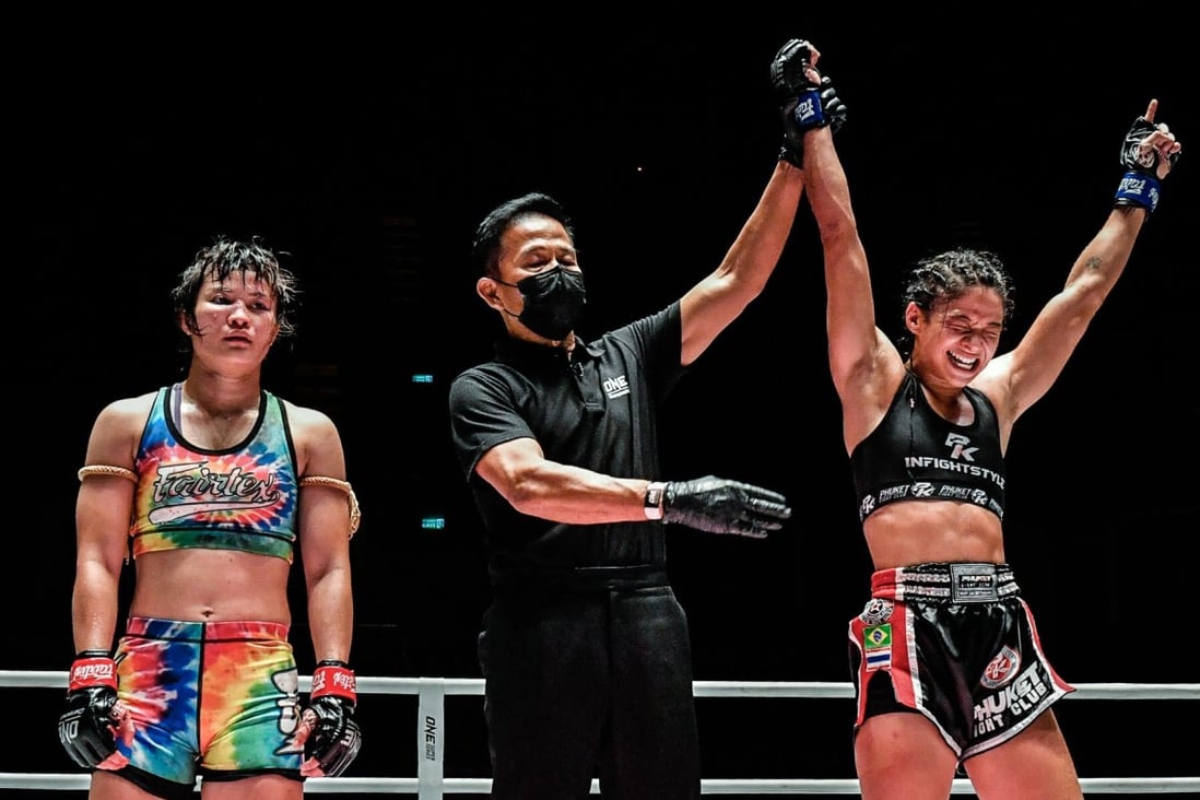 Stamp Fairtex is dejected as Allycia Rodrigues’ arm is raised. Photos: ONE Championship