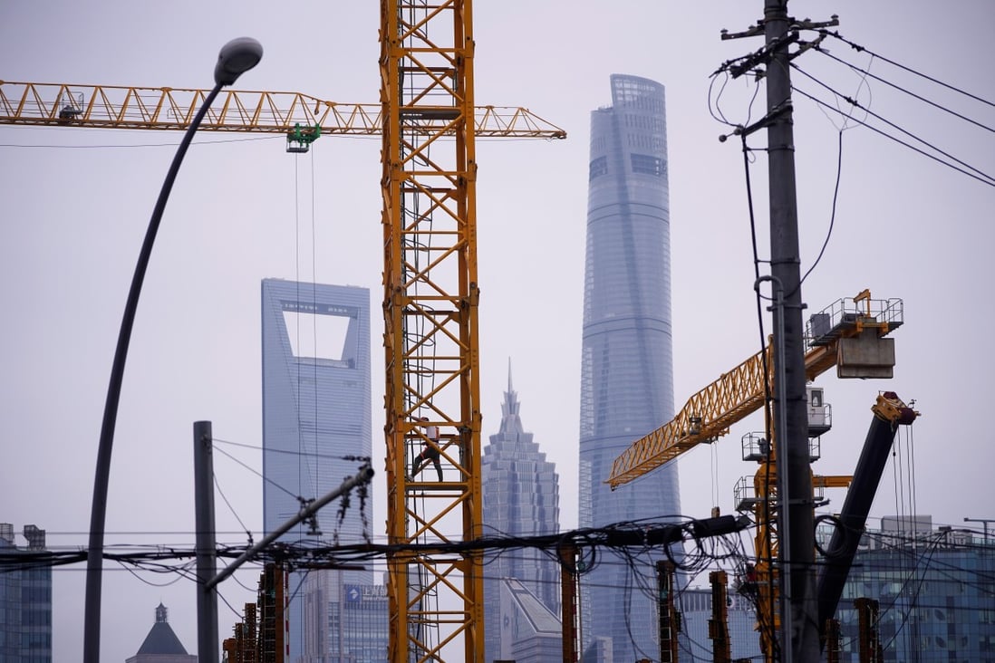 A construction site in Shanghai. Curbs introduced on the mainland cast a long shadow over major Chinese developers listed in Hong Kong. Photo: Reuters