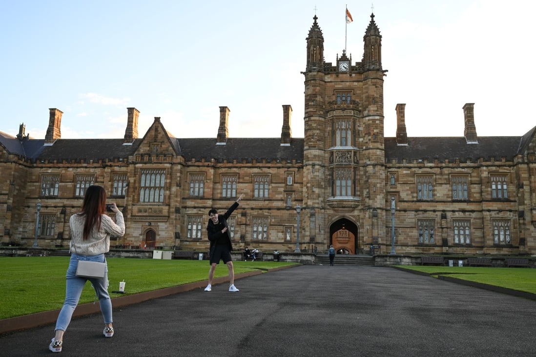 Students take photos on the University of Sydney campus. Australia’s government has proposed an inquiry by the security and intelligence committee into spiralling interference at public universities. Photo: Reuters