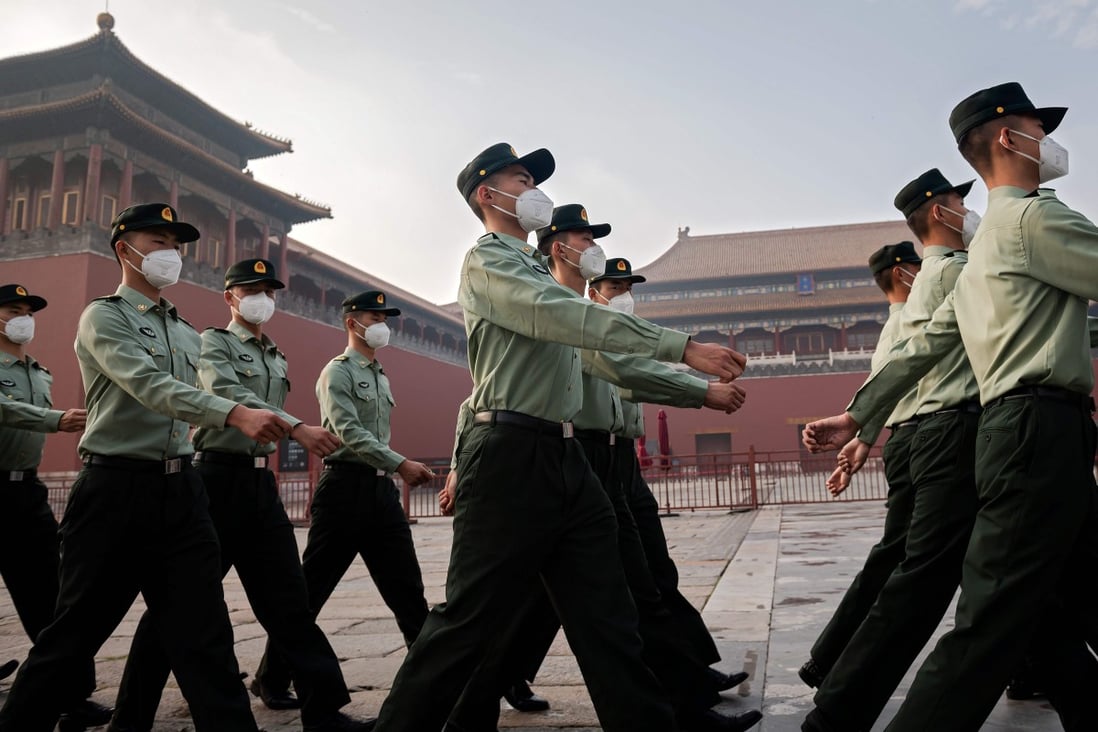 People’s Liberation Army soldiers march next to the entrance to the Forbidden City during the opening ceremony of the Chinese People’s Political Consultative Conference in May in Beijing. Photo: AFP