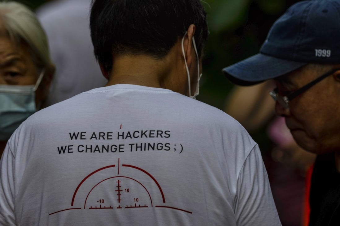 A man wearing a T-shirt bearing the slogan ‘we are hackers, we change things’ pictured in Shanghai in August. Photo: EPA