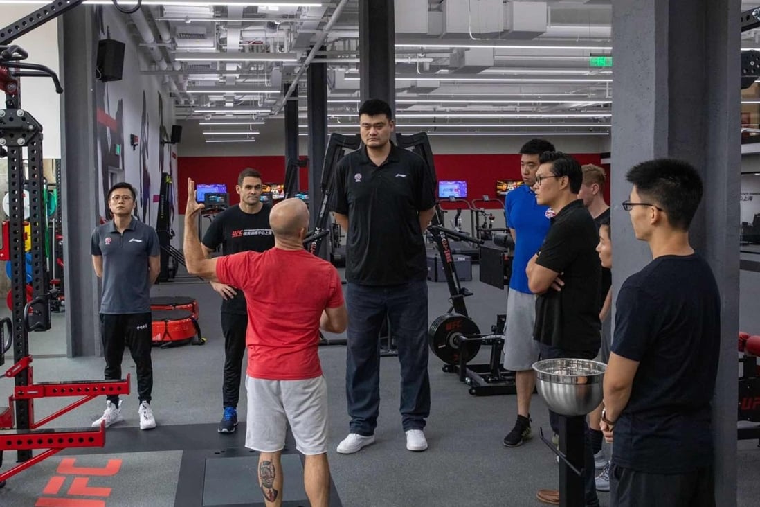 NBA legend and Chairperson of Chinese Basketball Committee Yao Ming with UFC Shanghai Performance Institute coaches and Kevin Chang, UFC vice-president of Asia Pacific. Photo: Handout