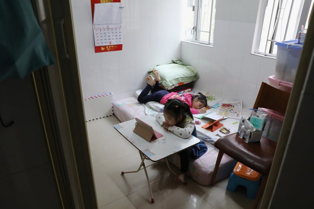 Children do their homework in a subdivided flat in Tsuen Wan. Many children in Hong Kong lack access to a digital device for online learning, which has been the norm for most of 2020. Photo: K.Y. Cheng