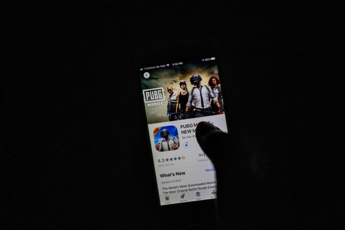 A man looks at the download page for PUBG Mobile, owned by Chinese internet giant Tencent, in Apple’s App Store on an iPhone in New Delhi on September 2. Photo: AFP
