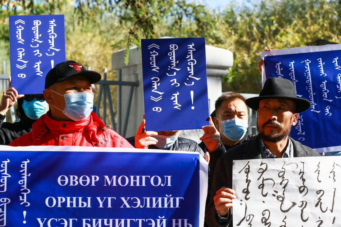 Mongolians hold placards protest in Ulan Bator the capital of Mongolia, against neighbouring China’s plan to teach core subjects in Mandarin not Mongolian in schools in Inner Mongolia, an autonomous region of China. Photo: EPA-EFE