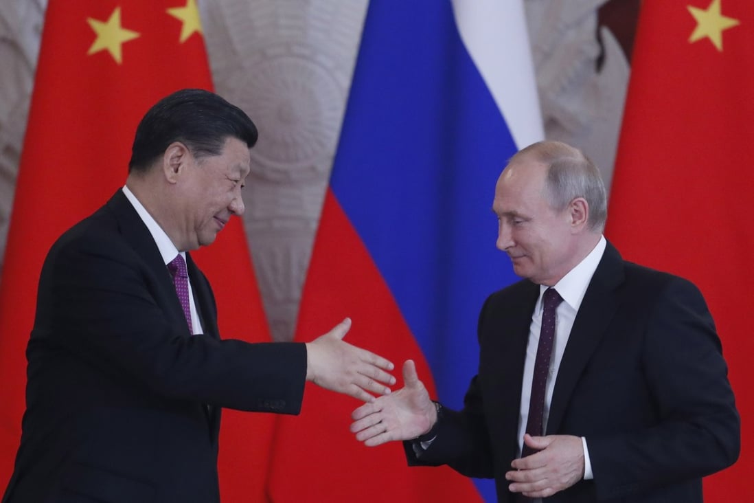 Chinese President Xi Jinping and his Russian counterpart Vladimir Putin shake hands in Moscow in 2019. Photo: EPA-EFE