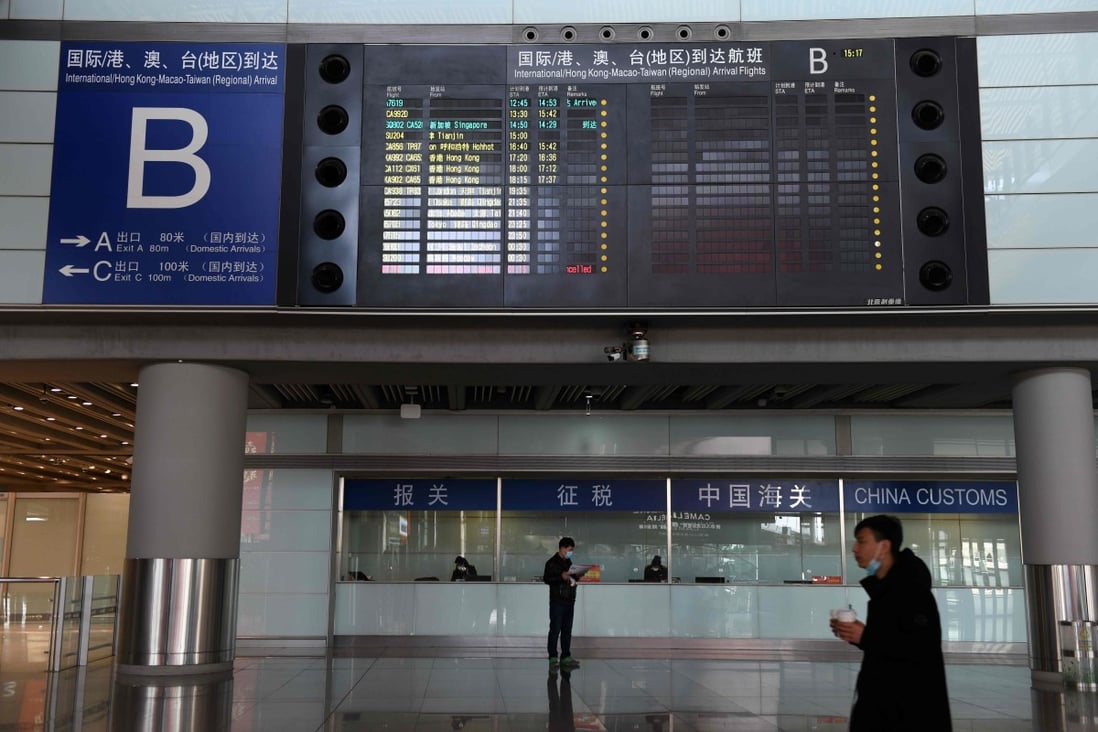 Foreign staff trying to get back to China have to wait for their visa applications to be processed and try to get on one of the limited number of international flights. Photo: AFP