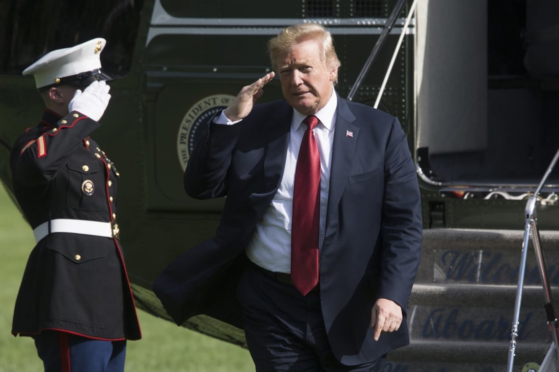 US President Donald Trump salutes a US marine after arriving on the South Lawn of the White House on Marine One in June 2018. Photo: EPA-EFE