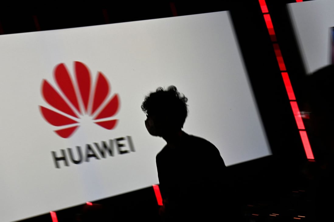 A visitor walks past the logo of Huawei Tehnologies displayed on a screen during the IFA international trade show for consumer electronics and home appliances, held from September 3 to 5 in Berlin. Photo: Agence France-Presse