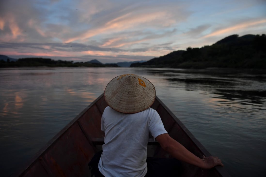 A fisherman on the Mekong River in northeastern Thailand, with Laos on the left. Photo: AFP