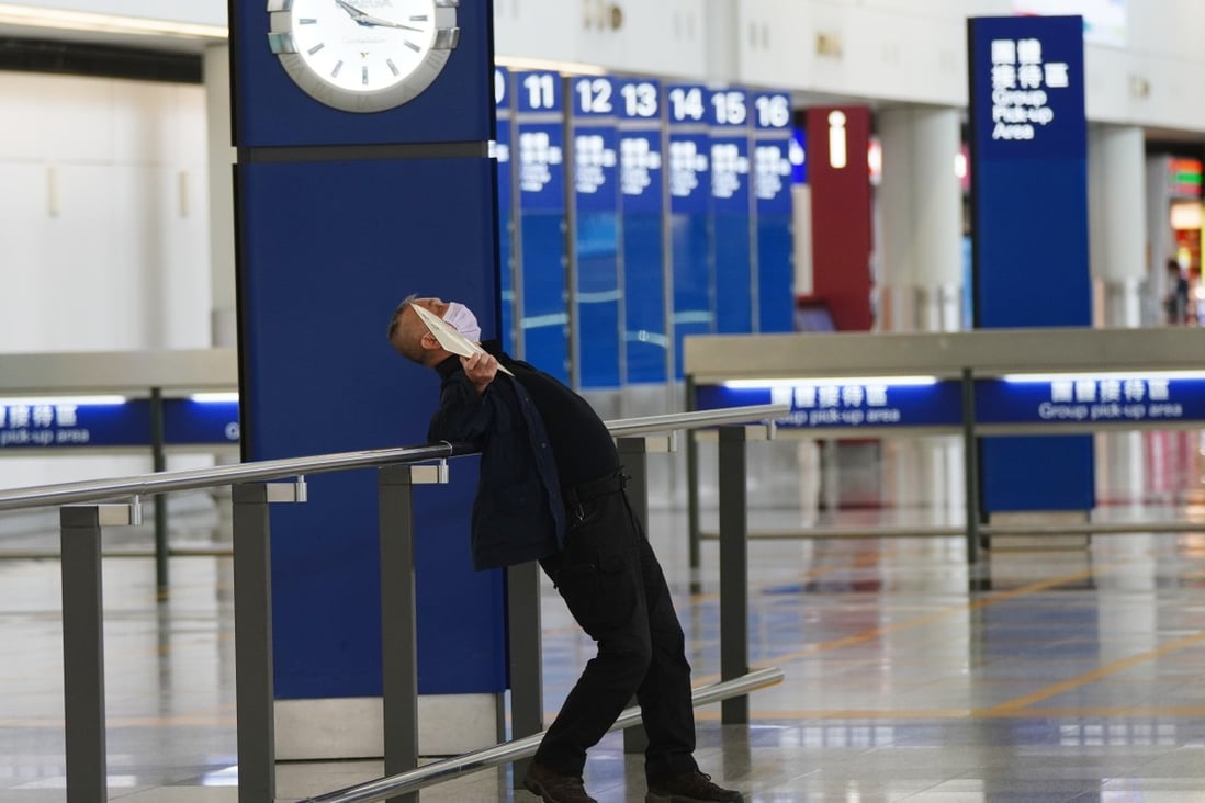 A man waits for a group of arrivals at a nearly empty Hong Kong International Airport earlier this year. Photo: Sam Tsang