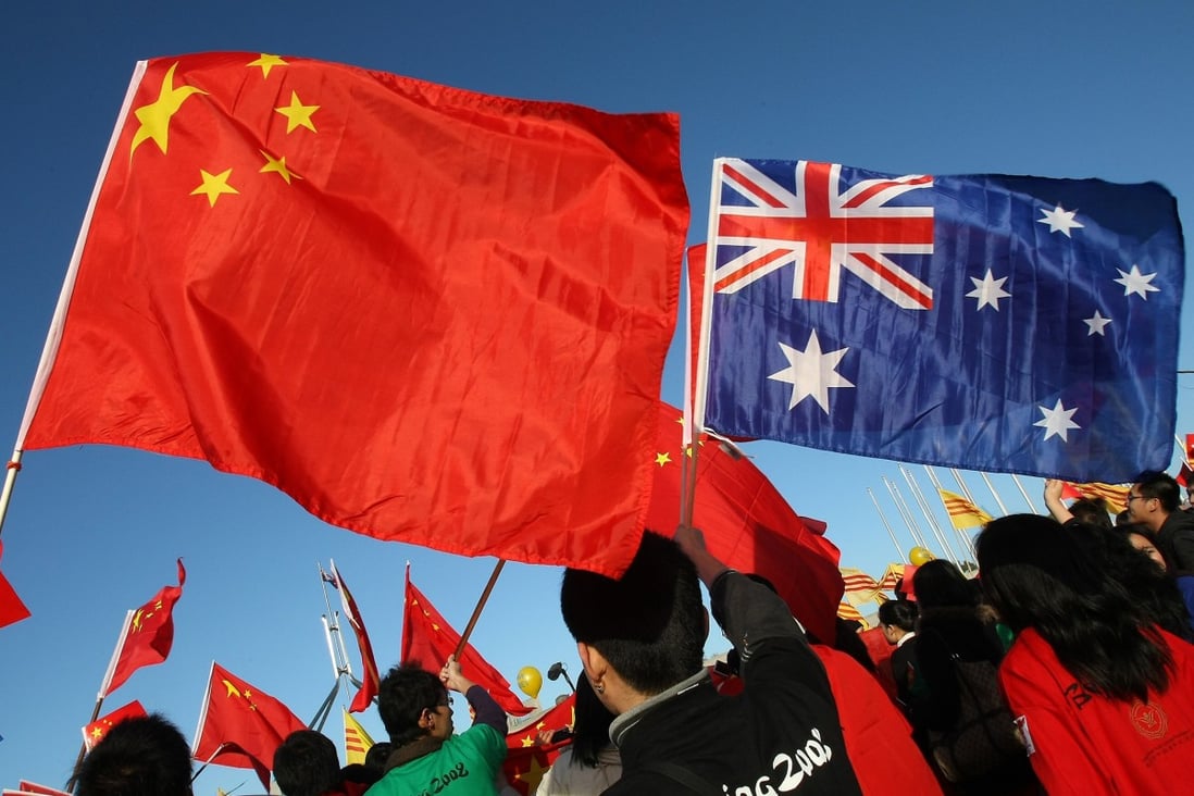 Thousands of Chinese supporters rally outside Parliament House during the Beijing 2008 Olympic torch relay through Canberra in 2008. Photo: AFP