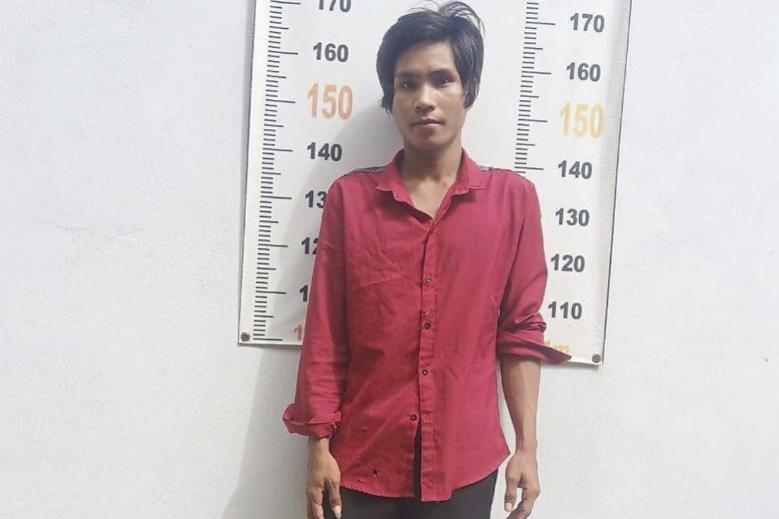 Nhel Thearina poses for a photo at the police station after his arrest in Tbong Khmum, Cambodia on Tuesday. Photo: Tbong Khmum Police via AP
