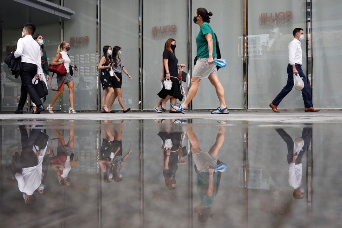 Office workers in Singapore. Photo: Reuters