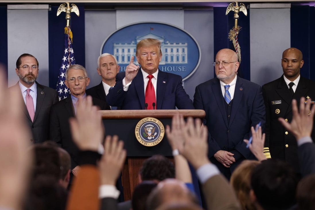 President Donald Trump answers questions after speaking about the coronavirus at the White House in Washington as Health and Human Services Secretary Alex Azar, National Institute for Allergy and Infectious Diseases Director Dr Anthony Fauci, Vice President Mike Pence, Robert Redfield, director of the Centres for Disease Control and Prevention and US Surgeon General Dr Jerome Adams listen. Photo: Carolyn Kaster / AP Photo