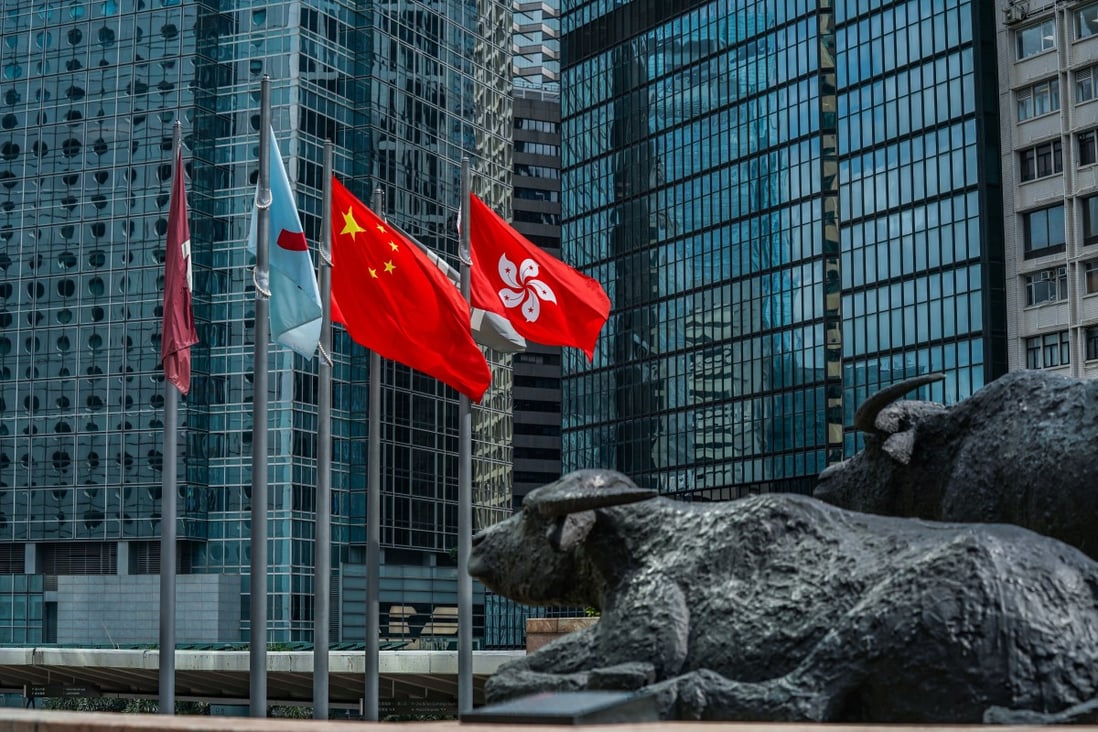 The flags of China and Hong Kong fly outside Exchange Square, which houses the Hong Kong stock exchange, on May 29. Photo: Bloomberg