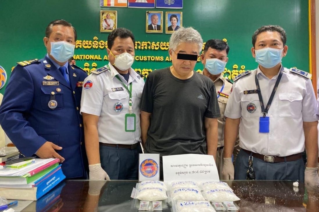 Cambodian customs authorities pictured with Japanese national Nonaka Shunichi and the drugs found in his luggage at Phnom Penh International Airport. Photo: Handout