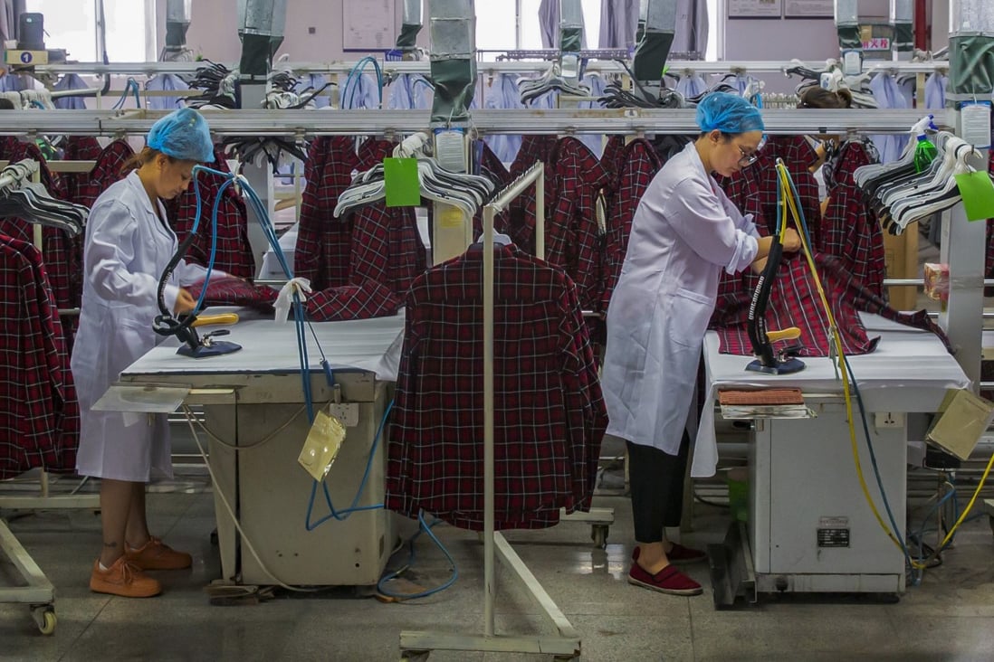Workers iron shirts in an apparel factory in Haian city, in east China’s Jiangsu province. While China has lost market share in sectors such as apparel exports, it has still managed to contribute far more to overall export growth than any other economy. Photo: AP