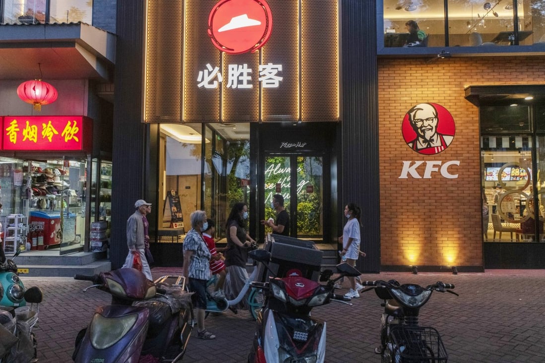 Pizza Hut and KFC restaurants in Beijing. Yum China was among the earliest restaurant groups in China to embrace delivery. Photo: Bloomberg