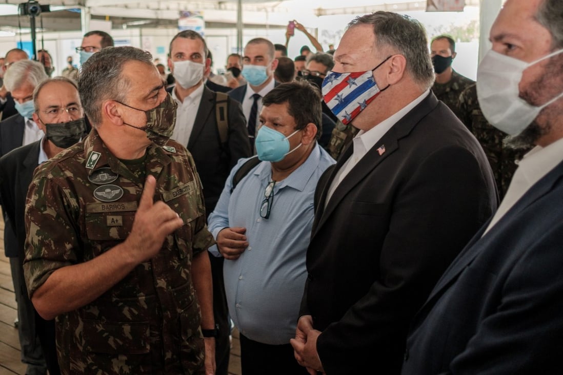US Secretary of State Mike Pompeo and Brazilian Foreign Minister Ernesto Araujo (first right) attend an event at an air base in Roraima. Photo: AP