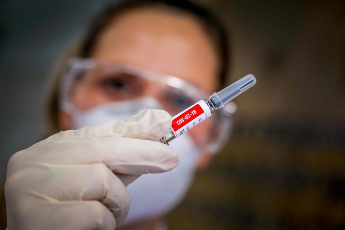 A nurse holds a Covid-19 vaccine candidate produced by Chinese company Sinovac Biotech at the Sao Lucas Hospital in Brazil in August. Photo: AFP