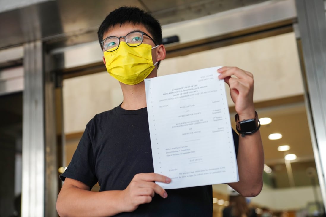 Joshua Wong speaks to reporters after his application for a judicial review of his banning from last year’s district council elections was rejected. Photo: Sam Tsang