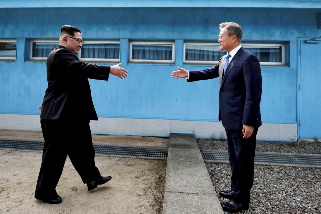 South Korean President Moon Jae-in (right) and North Korean leader Kim Jong-un shake hands at the truce village of Panmunjom inside the demilitarized zone separating the two Koreas in April 2018. Photo: Reuters