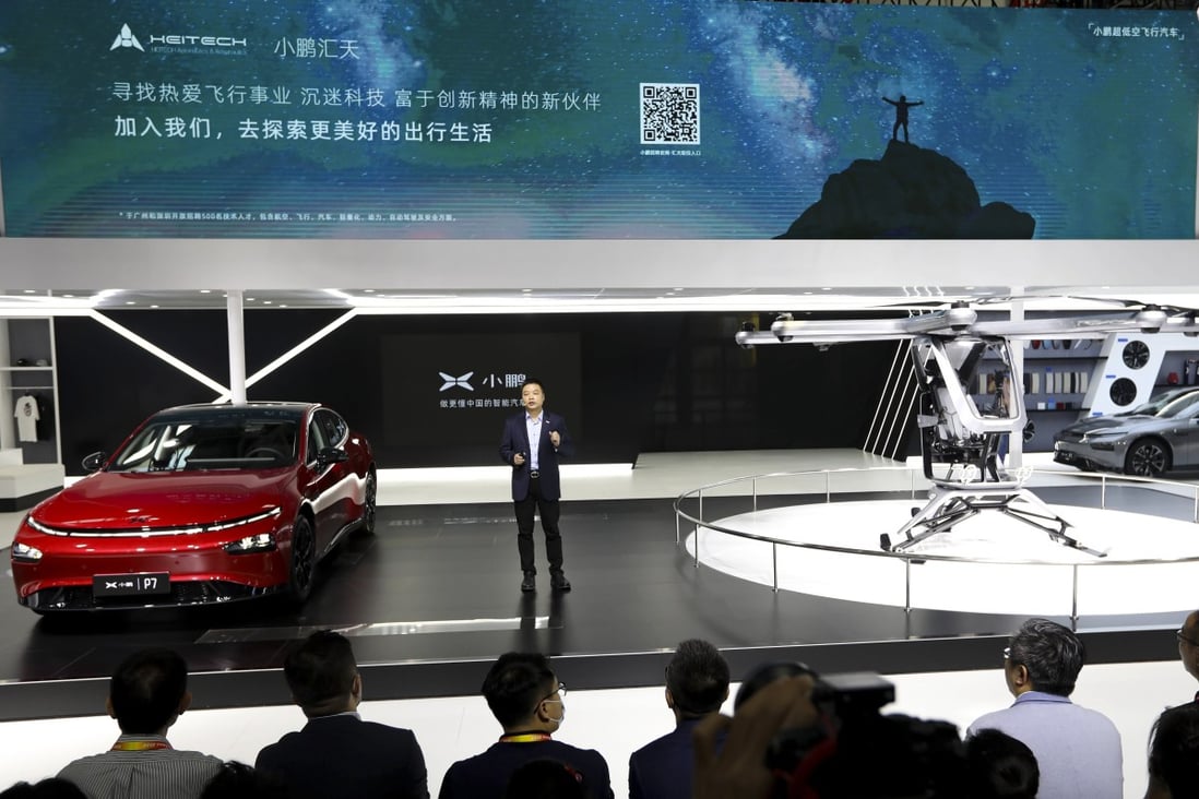 XPeng CEO He Xiaopeng unveils its Kiwigogo flying car, right, at the 2020 Beijing International Automobile Exhibition on Saturday September 26, 2020. Photo: Simon Song