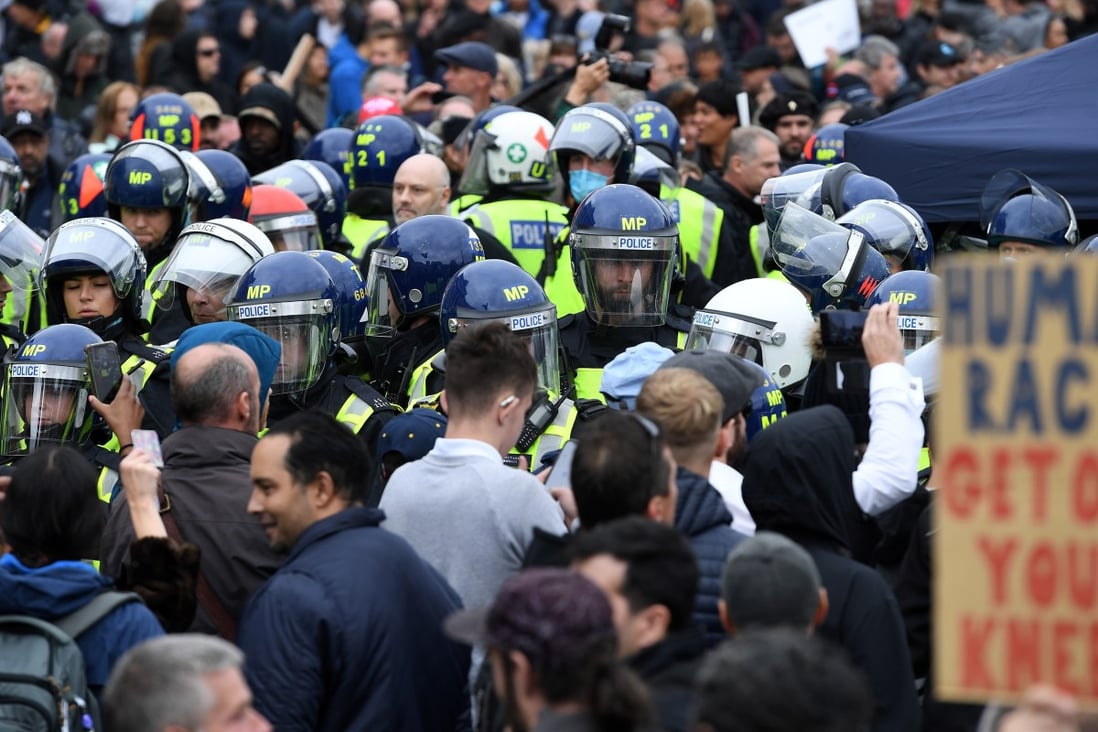 Police clash with protesters at a rally in Trafalgar Square in London on Saturday. Thousands of people turned out to attend the 'We Do Not Consent' rally to protest against new government coronavirus restrictions and vaccinations. Photo: EPA-EFE