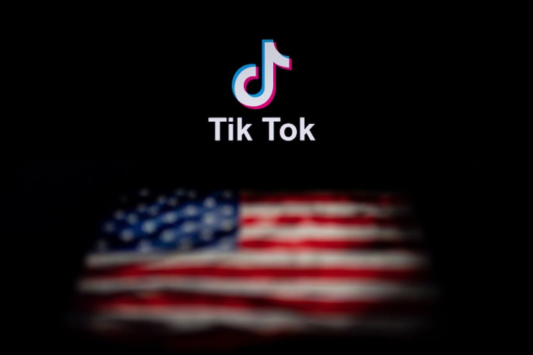 The logo of the social network application TikTok and a US flag on the screens of two laptops in Beijing. Photo: AFP