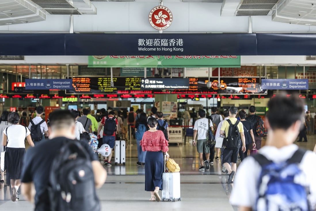 People cross from the Futian Border in Shenzhen, into Hong Kong’s Lok Ma Chau Border Station, before the coronavirus stopped travel. Photo: Roy Issa
