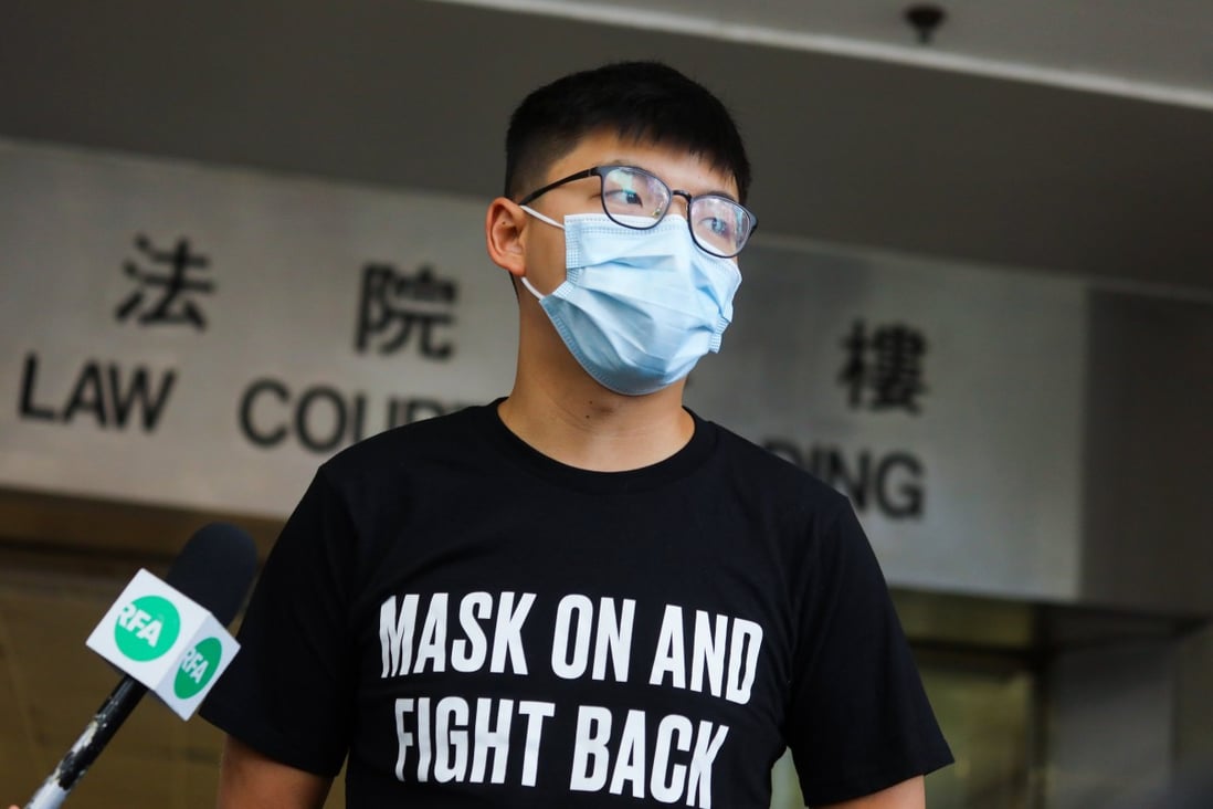 Activist Joshua Wong speaks to reporters after leaving Hong Kong’s Eastern Court on Wednesday. Photo: Xiaomei Chen