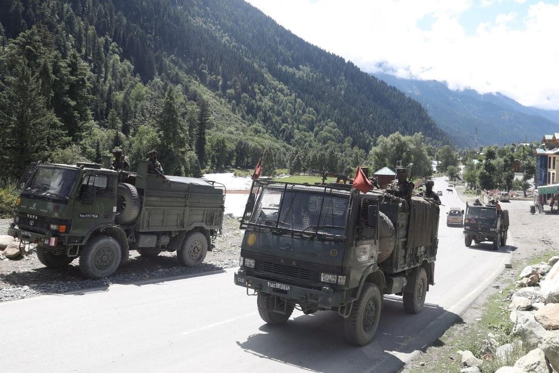 Indian army vehicles drive along a highway leading to Ladakh. Photo: EPA-EFE