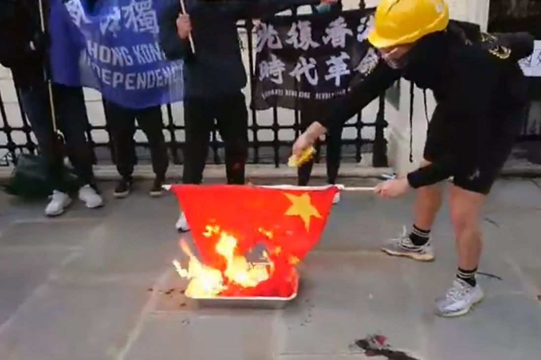 The five-starred red flag is set alight outside the Chinese embassy in London on 71st anniversary of the founding of the People’s Republic of China. Photo: Twitter