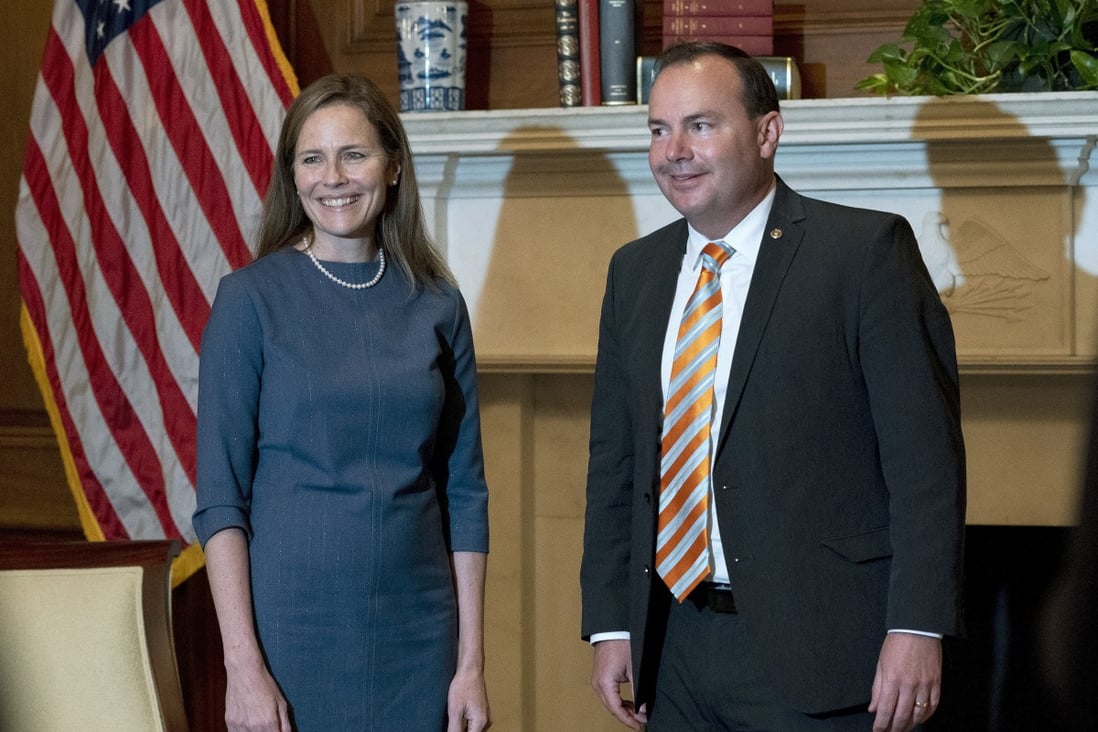 Judge Amy Coney Barrett, US President Donald Trump's nominee to the Supreme Court, poses with Senator Mike Lee at the Capitol on Tuesday. Photo: AP