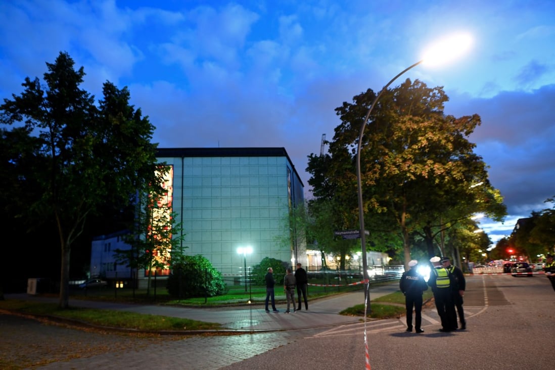 Police secure the area where a Jewish man was attacked in front of a Hamburg synagogue. Photo: Reuters