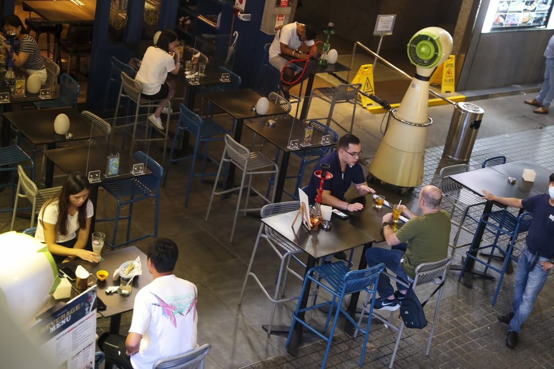 Customers drink at a bar in Tsim Sha Tsui on Monday evening. Photo: Edmond So