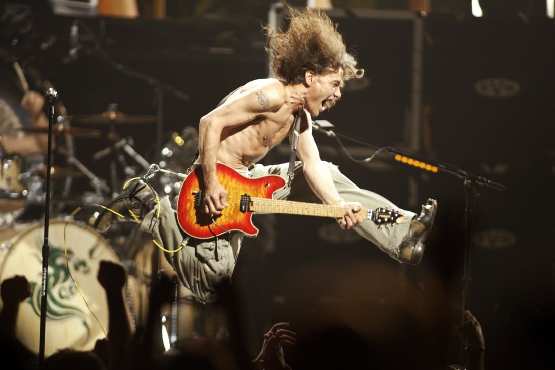 Eddie Van Halen plays the final chord of ‘Jump’ during a Van Halen concert in New Jersey in June 2004. Photo: NJ Advance Media via AP