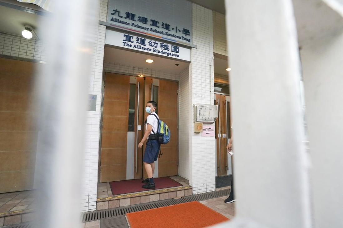 A student walks into the Alliance Primary School in Kowloon Tong. Photo: Felix Wong
