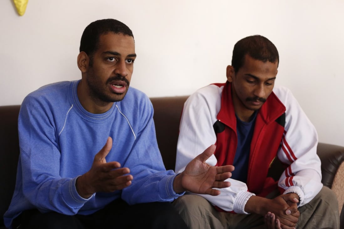 Alexanda Kotey (left, with El Shafee Elsheikh) speaks during an interview in Kobani, Syria in March 2019. Photo: AP