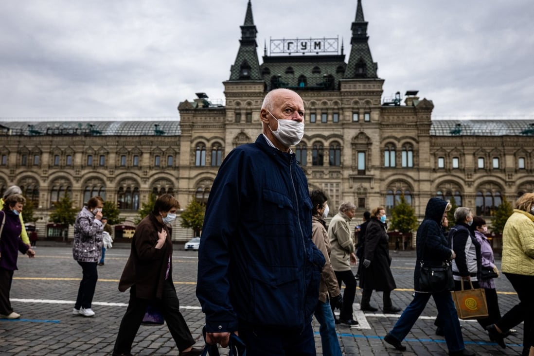 A man wearing a face mask to protect against the coronavirus walks on Red Square in central Moscow. Photo: AFP