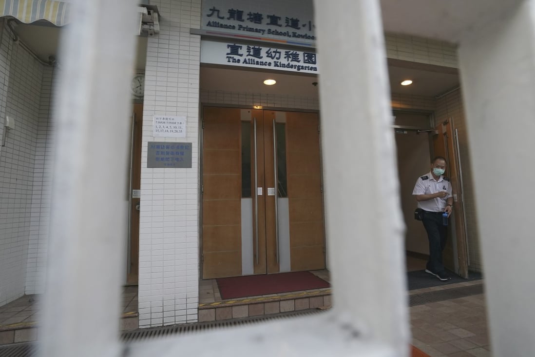 A security guard stands outside the Alliance Primary School in Kowloon Tong on Tuesday. Photo: Felix Wong