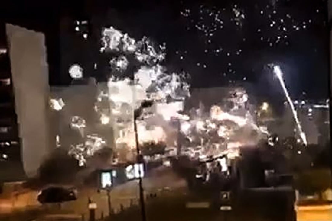 A screengrab of a Twitter video shows fireworks exploding outside the police station of Champigny-sur-Marne on Saturday night. Photo: Twitter @LeCapricieux94 / AFP