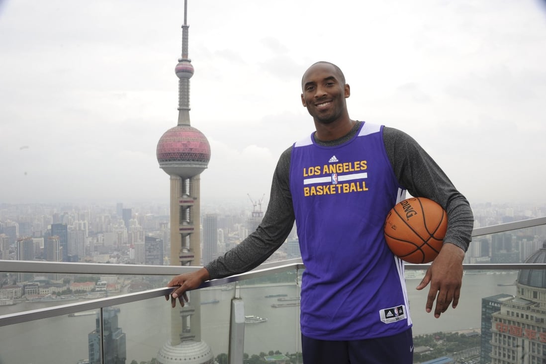 Kobe Bryant of the Los Angeles Lakers poses for a photo as part of the NBA Global Games in Shanghai in October, 2013. Photo: AFP