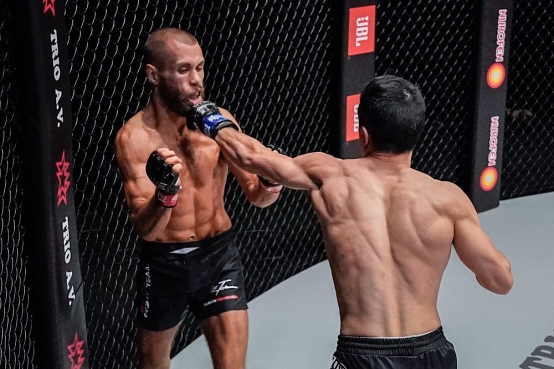 Reece McLaren lands a punch flush on Aleksi Toivonon's chin at ONE: Reign of Dynasties in Singapore. Photos: ONE Championship