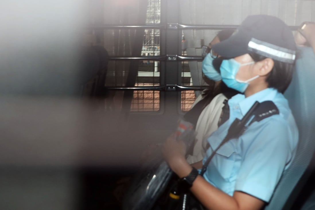 Chung Suet-ying (rear) is escorted to Fanling Court to be charged with one count of possession of arms or ammunition without a licence on Monday. Photo: K. Y. Cheng