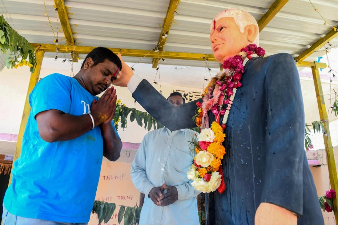 Bussa Krishna, who died on Sunday, offers special prayers to the statue of US President Donald Trump, at his residence in Telangana state, 120km from Hyderabad, in February 2020, ahead of Trump’s visit to India. Photo: AFP